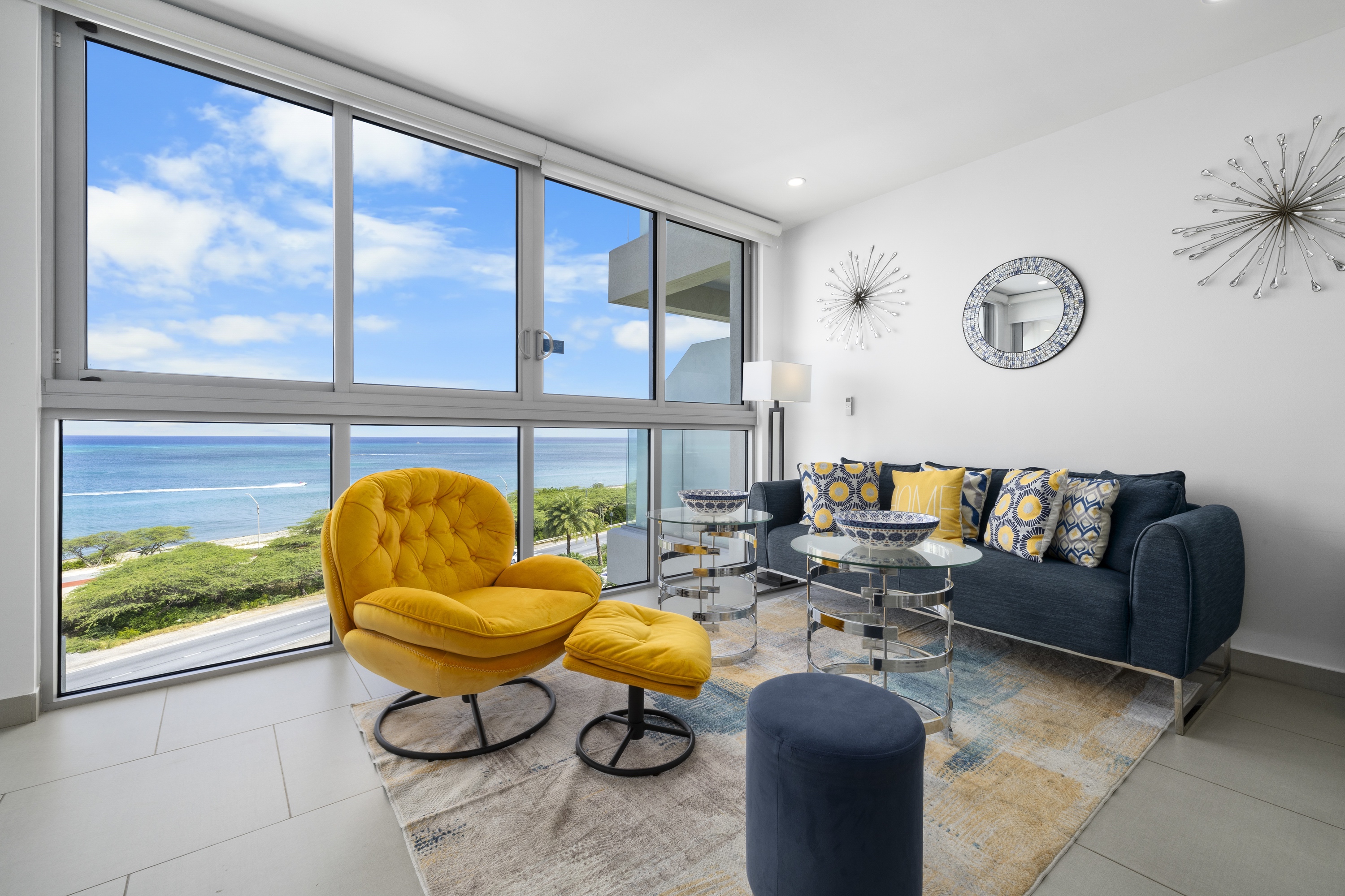Living room open to the Caribbean sea at an Aruba Ocean Views residence