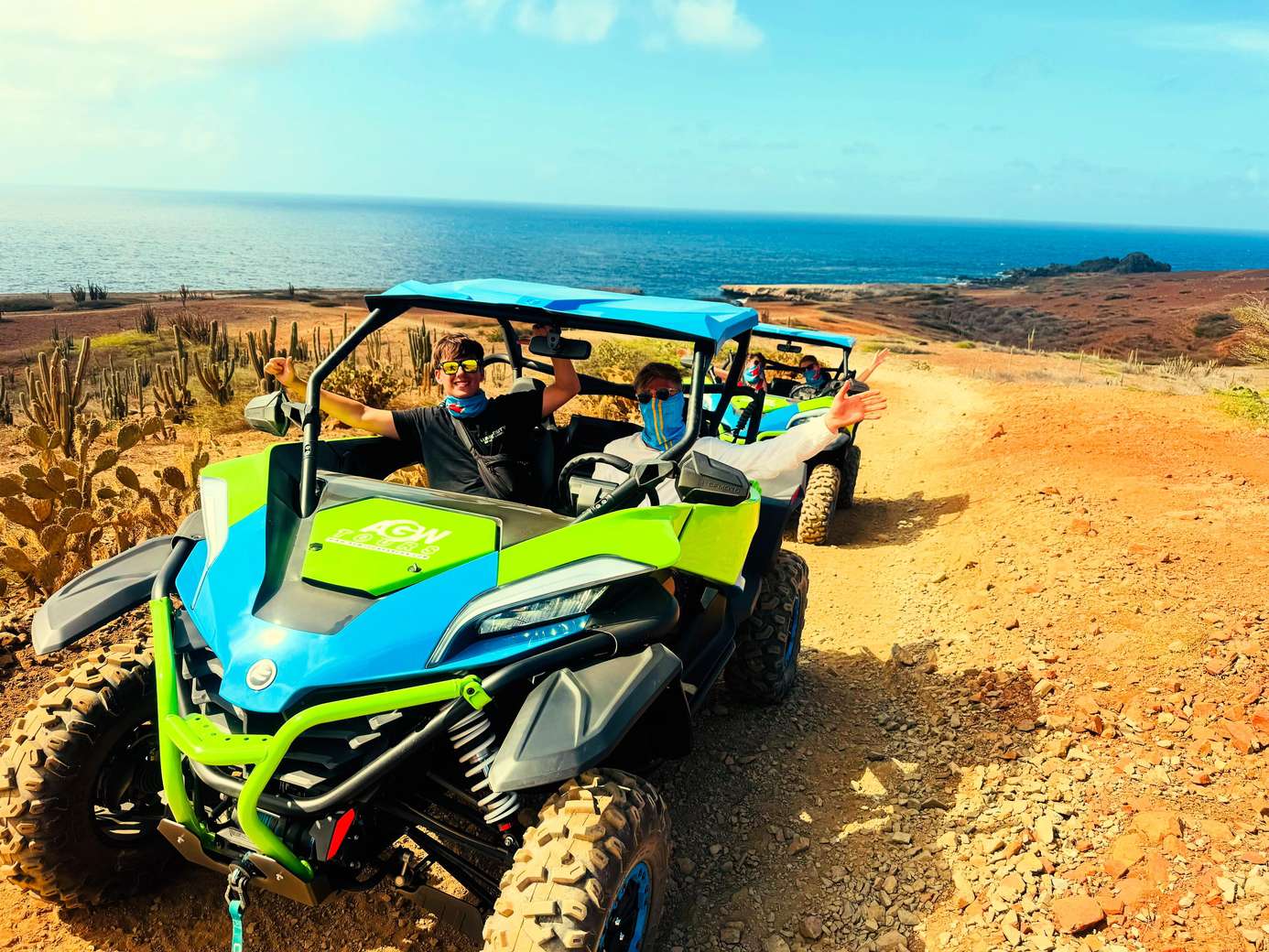 Guests on an open-air UTV tour along Aruba's rugged coastline