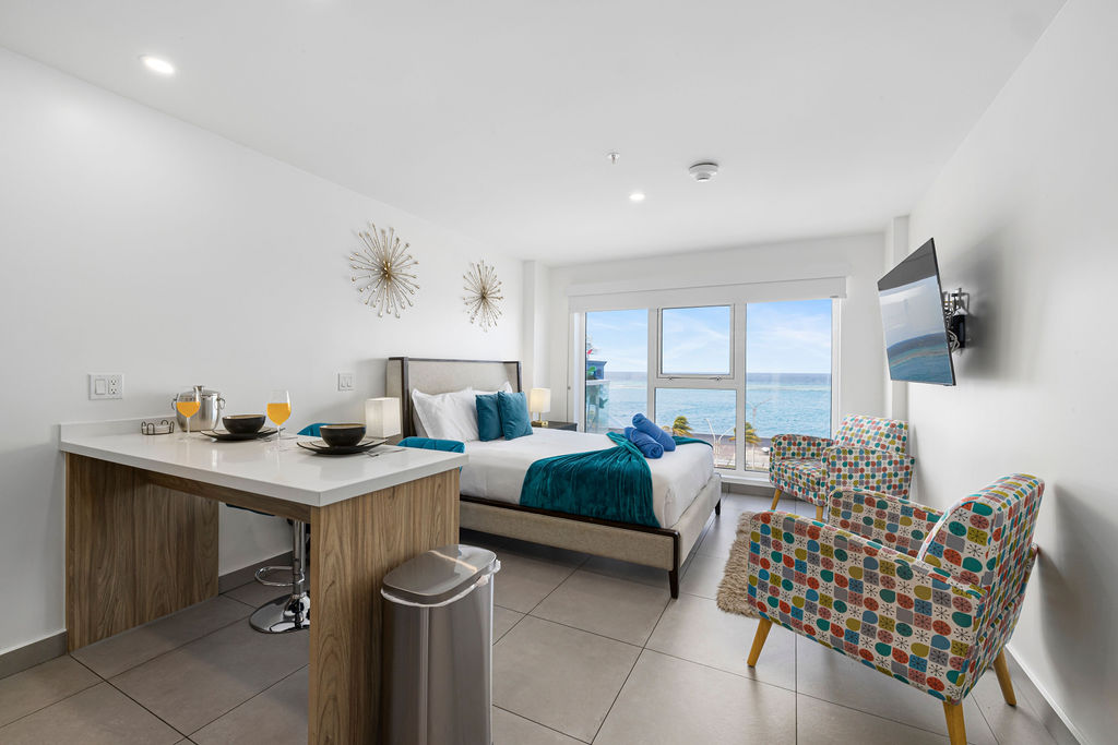 Harbour House studio with king bed facing the open Caribbean and cruise port