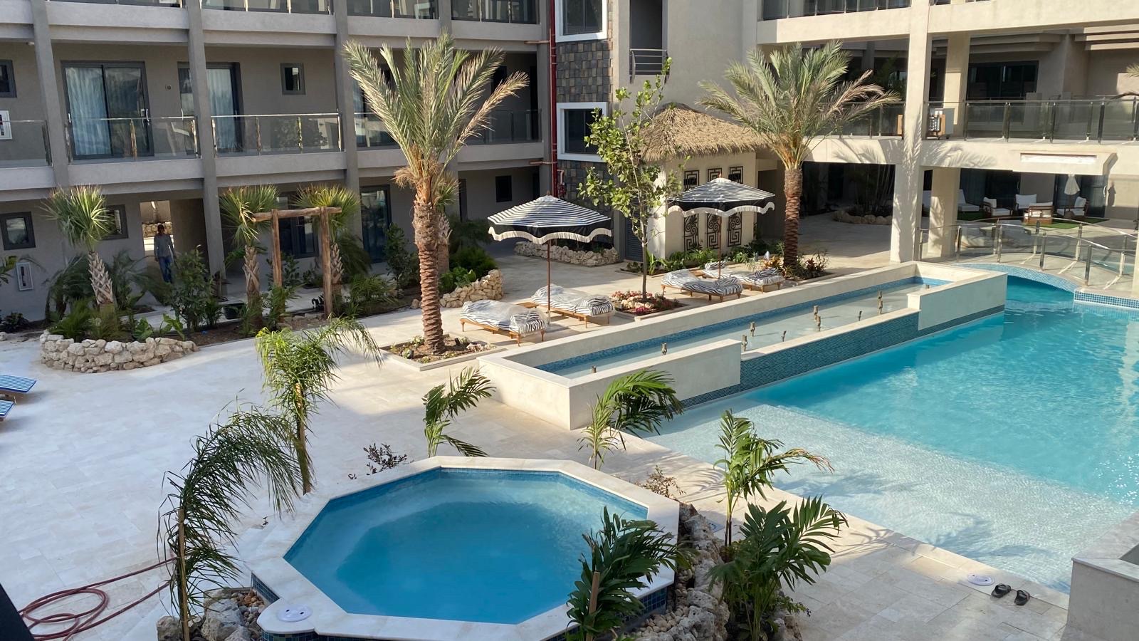 Elevated view over the pool, hot tub, and lounge terrace at Walishali